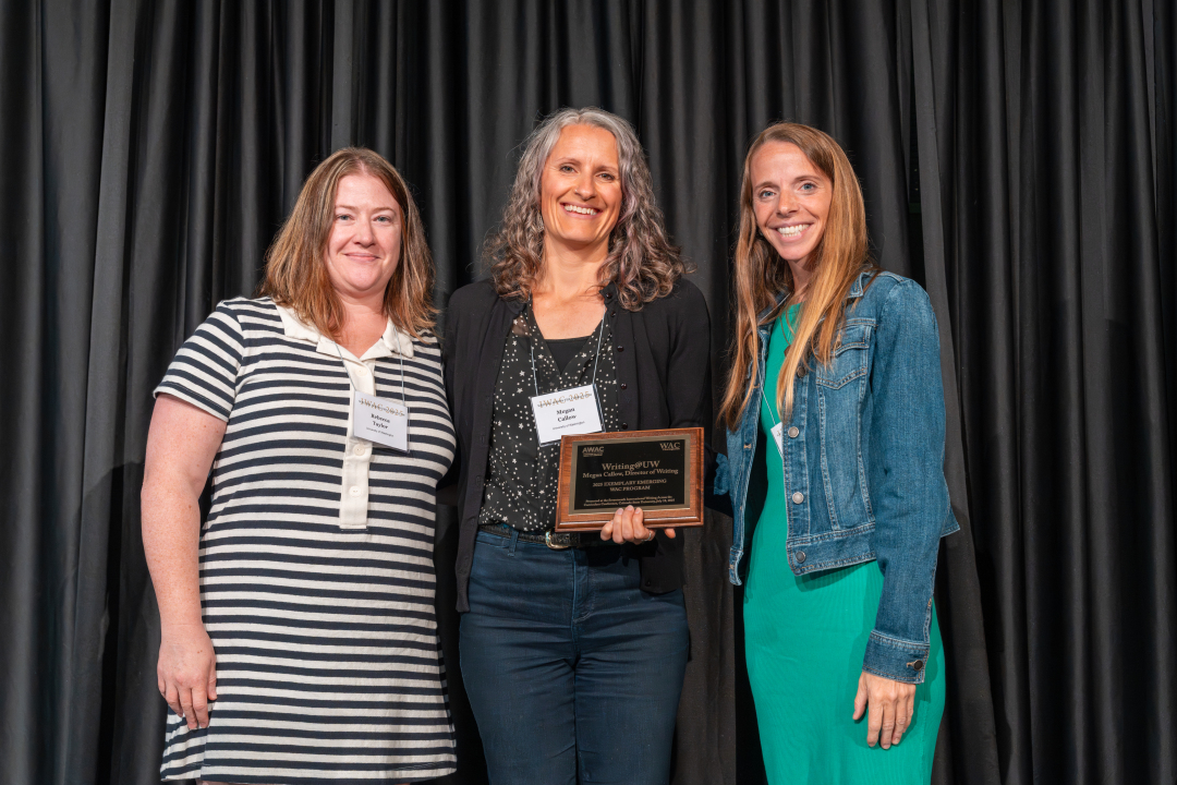 Megan and Rebecca receiving the 2025 Exemplary WAC Program award.