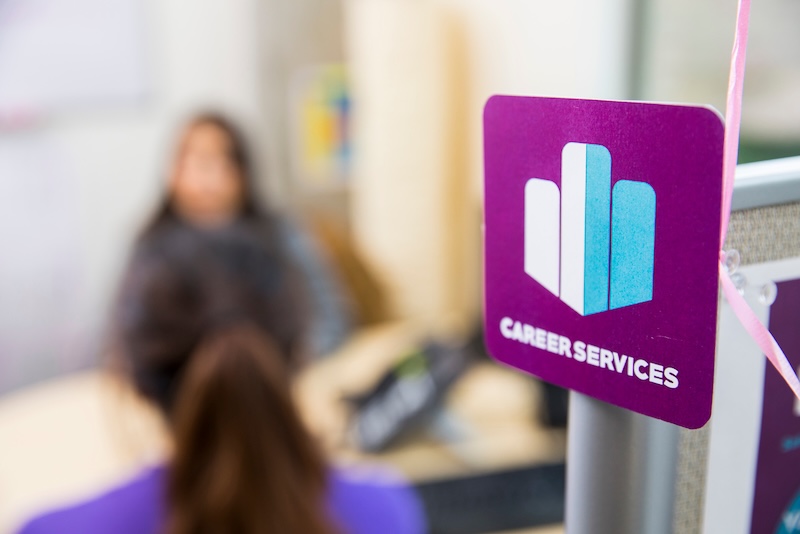 Career Services logo on a partition wall in an office