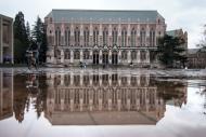 Photo of Suzzallo Library and its reflection in a puddle